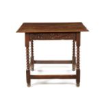 A Charles II carved oak side table