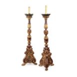 A pair of large freestanding giltwood and painted torcheres, Italian, 18th century
