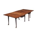 An early George III mahogany two section drop flap gate-leg action dining table
