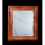 A large William and Mary walnut cushion frame mirror