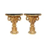A pair of 18th century Italian carved gilt wood console tables