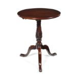 An unusual George III carved mahogany tripod table