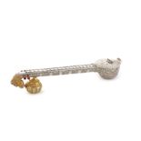An Indian novelty parcel-gilt silver betel nut container in the form of a stick zither,