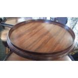 A large late George III mahogany two-tier dumb waiter