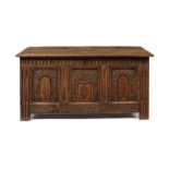 A Charles I carved oak panelled chest