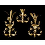 A set of three 1950's French gilt metal wall lights attributed to Maison Baguès