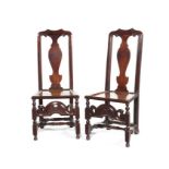 An unusual pair of Queen Anne or George I walnut side chairs