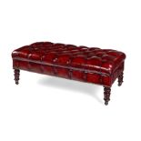 A leather upholstered deep buttoned ottoman