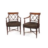 A pair of Regency mahogany open armchairs