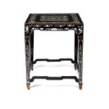 An early 18th century Chinese lacquer and engraved mother of pearl inlaid table top on a later base