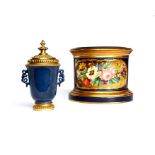 A 19th century Sèvres circular stand and a Chinese gilt bronze mounted blue porcelain pot