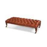 A 19th century leather upholstered ottoman stool