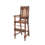 A rare William and Mary carved walnut child's high chair