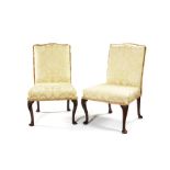 A pair of George III carved mahogany side chairs