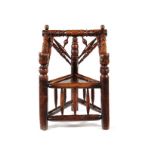 A Charles I yew triangular Turner's chair, English or Welsh, circa 1640