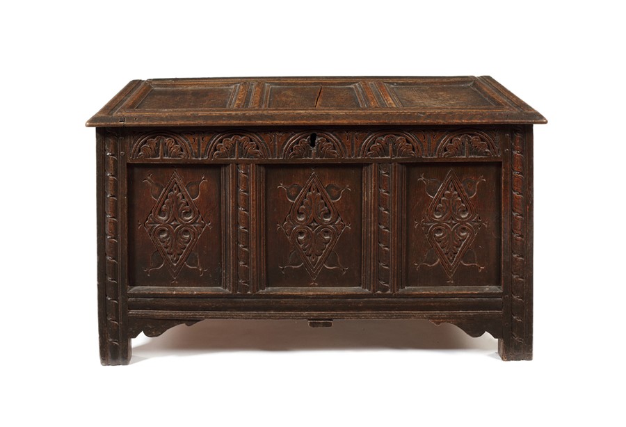 A Charles I carved oak panelled chest