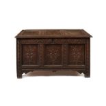 A Charles I carved oak panelled chest