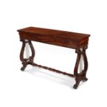 A narrow Regency carved mahogany side table