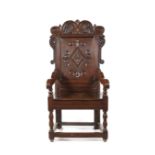 A Charles II carved oak open armchair, Yorkshire