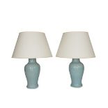 A set of three Chinese style light blue craquelure glazed table lamps