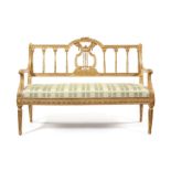 Late 19th century carved giltwood settee in the Louis XVI style