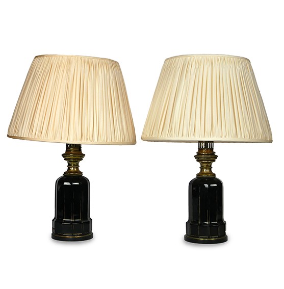 A pair of French black and gilt glass table lamps