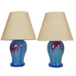 A pair of large Chinese style blue and red flambé glazed table lamps
