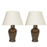 A pair of mottled brown glazed table lamps and a pair of brown glazed table lamps