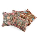 A near pair of needlework cushions together with another matched pair (4)