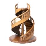 A mahogany model of a spiral staircase