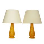 A pair of late Victorian Burmantofts ochre glazed faience table lamps