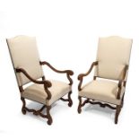 A pair of late 19th century French Louis XIV style beech wood carved fauteuils