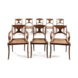 A set of six Regency faux rosewood dining chairs with a matching pair of later open armchairs