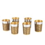 A fine set of six parcel-gilt silver beakers of heavy gauge by Stuart Devlin, London, 1968/69