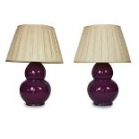 A large pair of purple glazed table lamps