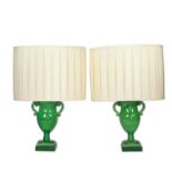 A pair of early 19th century green glazed terracotta table lamps