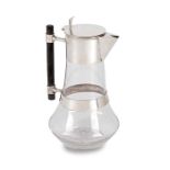 An Edwardian silver-mounted glass claret jug in the manner of Christopher Dresser