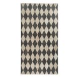 A contemporary diamond motif suede rug