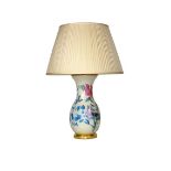 A Decalcomania table lamp and a pair of French eau de nil and floral glazed table lamp