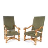 A pair of late 19th century French LXIV style giltwood carved open armchairs