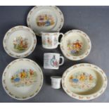 A group of Bunnykins and Peter Rabbit plates and bowls.