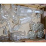 A group of antique glass including furniture rests, decanters and other jars with stoppers.