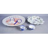 A 19th century Imari style dish, with pierced rim, a blue and white cup and tea bowl.
