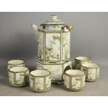A Japanese tea set comprising six tea bowls, teapot and stand.