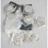 A group of commemorative coins, including Churchill and Elizabeth II examples.