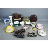 A group of boxes including an antique collar box and two pairs of binoculars.