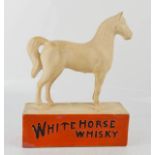 A White Horse Whisky advertising model, 25cm high.