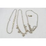 Two diamante dress necklaces and one mother of pearl earring and necklace set.