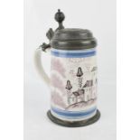 A German tin glazed manganese pewter lidded stein, bearing owners initials and having a ball
