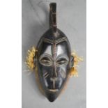 A small African carved mask.